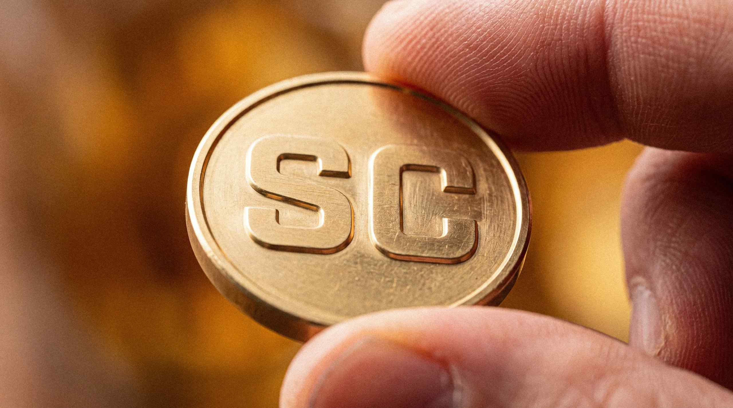 A figurative SC coin used for playing on sweepstakes casinos.